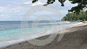 Waves crashing on Sandy beach, Sea surf on tropical sandy beach, Slow motion video