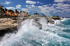 Waves crashing on the shore of Coco Cay