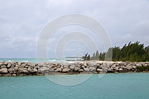 Waves crashing on the shore at a jetty