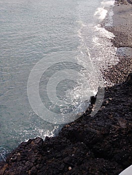 waves on the edge of the wide sea