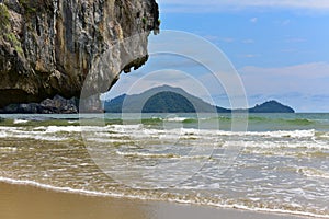 Waves eroding a cliff on a tropical island in Krabi photo