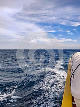 Waves from a ferry boat sailing awa from Phi Phi Islands in Thailand