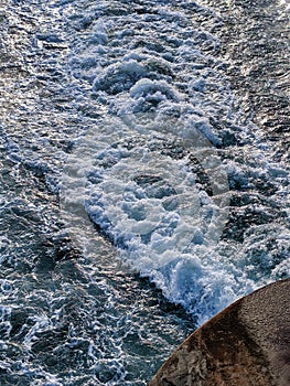 Waves, foam and wake from the back of a Washington State Ferry in the San Juan Islands