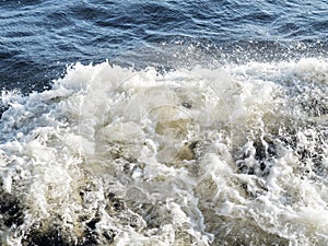 Waves formed from the propeller of the ship.