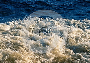 Waves formed from the propeller of the ship.