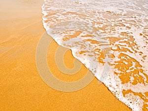 Waves on the gilded sand