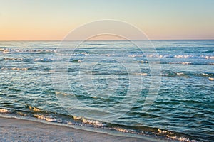 Waves in the Gulf of Mexico at sunrise, in Panama City Beach, Florida