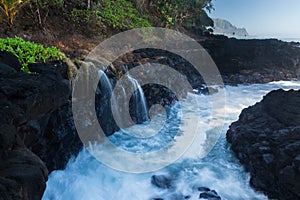 Waves hit rocks at Queens Bath Kauai