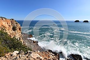 Waves hitting the base of the cliffs