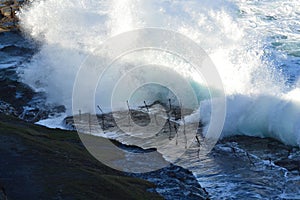 Waves hitting the bogey hole photo