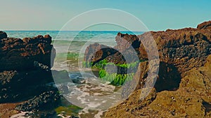 Waves hitting the rocks on the La Pineda beach in Salou Spain.