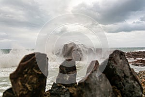 Waves hitting a sea rock with great force