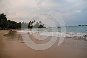 Indian ocean with sri lanka coastal sand