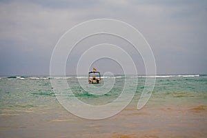 Indian ocean with sri lanka coastal sand