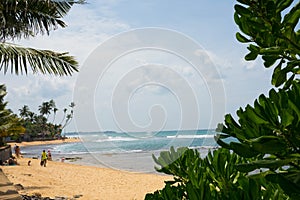 Indian ocean with sri lanka coastal sand