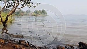 Waves on the lake side. Pan shot gently moving from the waves to the sky