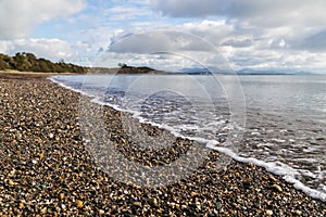 Waves lap up on Llanbedrog beach