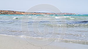 Waves lap up on Mellieha beach