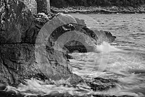 the waves lapping the rocks