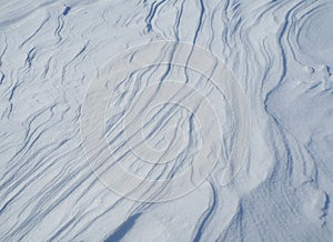Waves and lines created by the wind on fresh snow