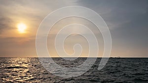 Waves on the marina beach at dusk in the city of Semarang, Indonesia