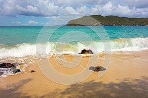 Waves meeting a pristine beach in the windward islands