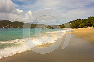 Waves meeting a pristine beach in the windward islands