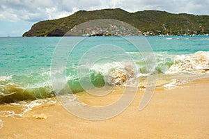 Waves meeting a pristine beach in the windward islands