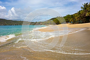 Waves meeting a pristine beach in the windward islands