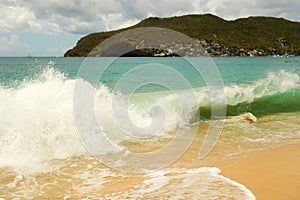 Waves meeting a pristine beach in the windward islands