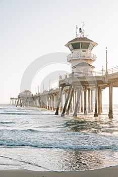 Waves in the Pacific Ocean and the pier in Huntington Beach, Orange County, California photo