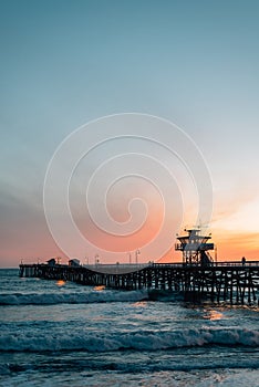 Waves in the Pacific Ocean and the pier at sunset in San Clemente, Orange County, California