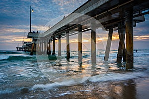Waves in the Pacific Ocean and the pier at sunset