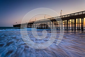 Waves in the Pacific Ocean and the pier at sunset, in Ventura, C