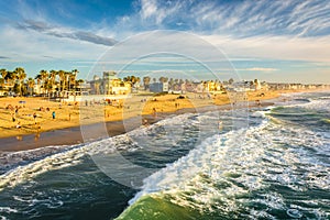 Waves in the Pacific Ocean and view of the beach from the fishing pier, in Imperial Beach, California.