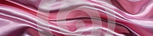 Waves of pink satin with a high-gloss finish, showcasing the fluid beauty and reflective sheen of the fabric.