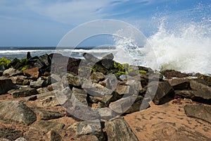Waves pounding rocks on a beach