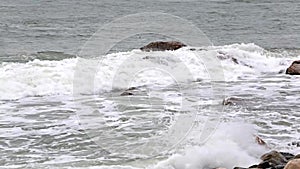 Waves pounding rocks coastal Maine