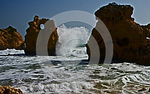 Waves at the praja de arrifes, portugal photo