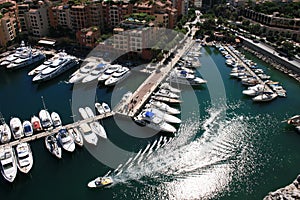 Waves reflecting sun astern of a speed-boat