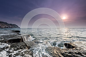 Waves, rock and sunrise