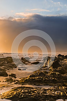 Waves and Rocks at Beach at Sunrise