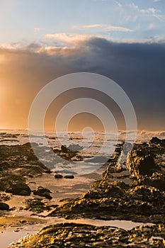 Waves and Rocks at Beach at Sunrise