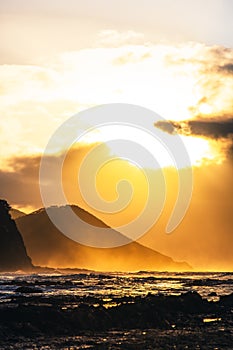 Waves and Rocks at Beach at Sunrise