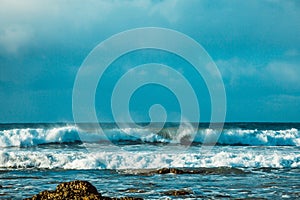 Waves and Rocks at Beach at Sunrise