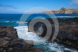 Waves by the rocky shore