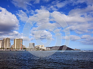 Waves roll in from ocean in front of Ala Wai Boat Harbor