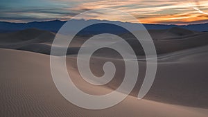 Waves of sand on top of the dunes. Sunrise. Desert in Mesquite F