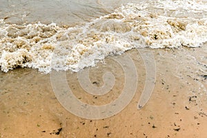 Waves on sandy beach