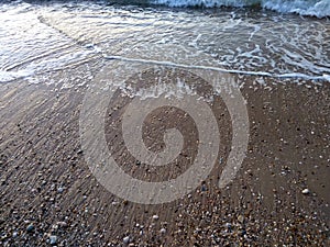 Waves on a sandy beach.